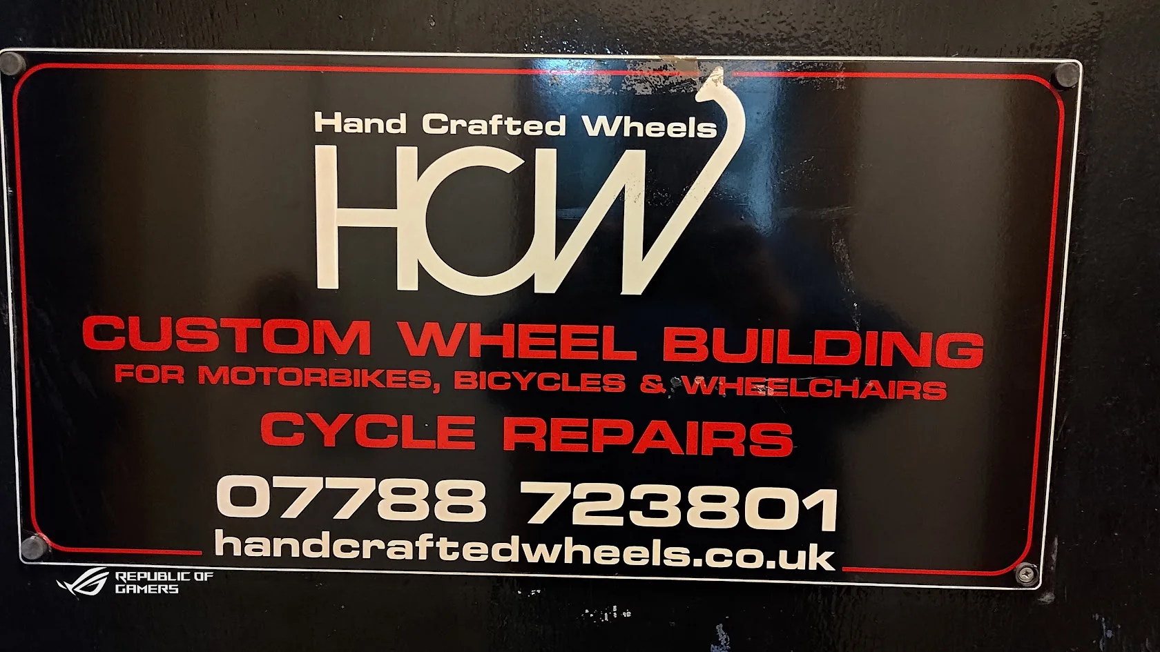 Hand Crafted Wheels workshop sign advertising custom wheel building and cycle repairs